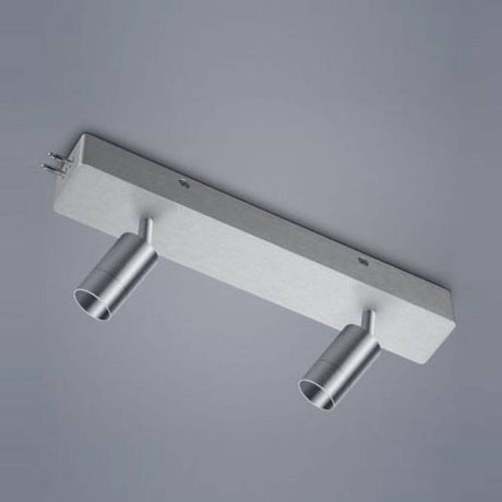 Module de spot double du système VIGO et boîtier de terminaison en aluminium mat sur fond gris.