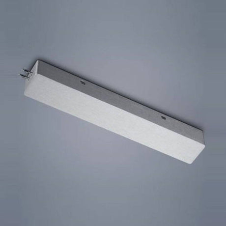 Boîtier d’alimentation du système VIGO pour alimentation en bout en aluminium mat sur fond gris.