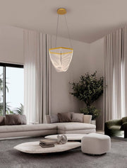 Valentin LED pendant light 3000K gold in a modern living room with elegant furnishings.