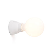KERA wall light in white with a modern design and round bulb, ideal for atmospheric lighting.