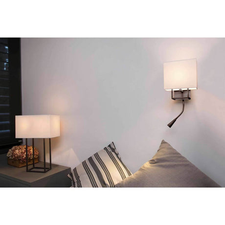 VESPER wall light with LED reading lamp in Brown, Beige on a wall next to a table with a side lamp.