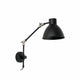 Wandleuchte CELIA Schwarz an der Wand montiert mit flexibler Arm und modernem Design.