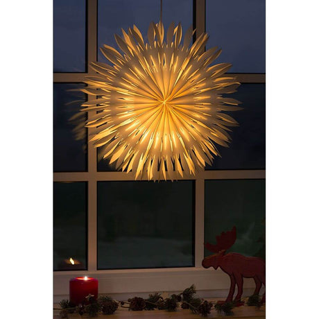Weißer Papierstern ohne Leuchtmittel E14 Lampenhalterung beleuchtet in einem Fenster.