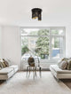 Zane Deckenleuchte Schwarz, Gold in modernem Wohnzimmer mit hellen Sofas und stilvoller Einrichtung.