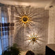 s.luce Diator Wand- und Deckenleuchte mit Sonne-Design, handgeschmiedet, erzeugt faszinierende Lichteffekte.