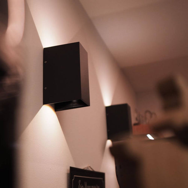 s.luce Ixa XL rectangular cover for Ixa base on a wall, modern design, black surface.