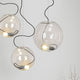 Moderne s.luce Sphere Hängeleuchte mit gläsernen Kugeln und asymmetrischer Lichtverteilung für stimmungsvolle Beleuchtung.