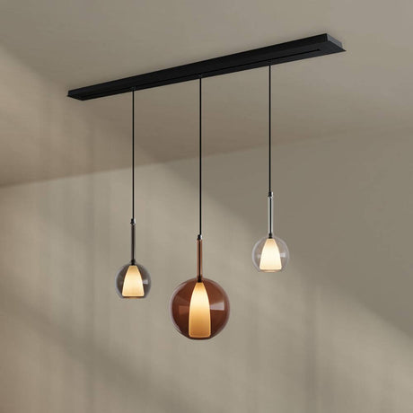 s.luce Belluna Esstischleuchte 3-flammig 160cm Baldachin mit drei Pendeln aus Glas in Cognac und klar.