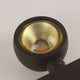 Detail shot of the s.luce Beam light with a gold reflector surface for elegant light design.