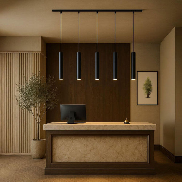 s.luce Crutch pendant lamp 1-phase track 200 cm end feed over a modern reception counter.