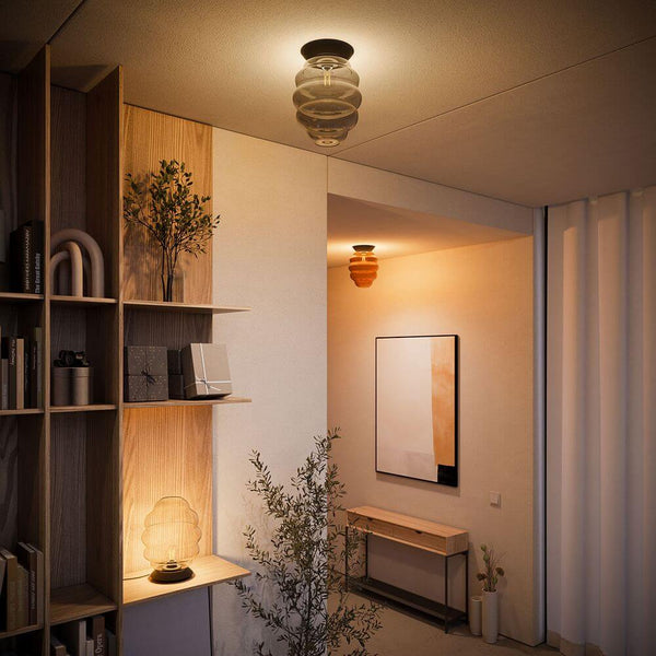 s.luce Echos glass ceiling light E27 in a modern living space, stylish design made of glass and light, harmonious illumination.