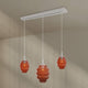 s.luce Echos Esstischlampe 3-flammig 120cm Ø 18/25cm mit orangefarbenen Glaskörpern am Baldachin.
