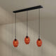 s.luce Echos Esstisch-Hängelampe 3-flammig 120cm Ø 18cm mit drei mundgeblasenen Glaskörpern in Orange.