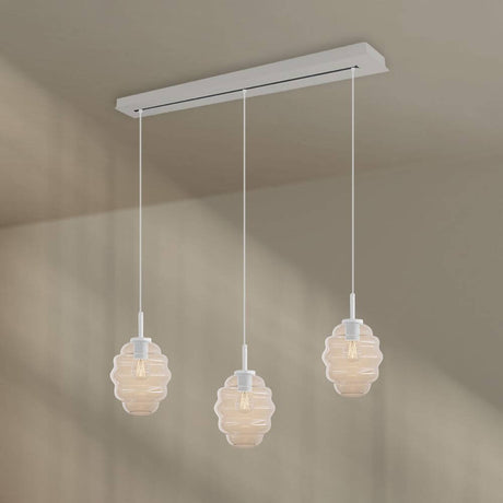 s.luce Echos Esstisch-Hängelampe 3-flammig 120cm Ø 18cm mit strukturierten Glaskörpern in warmen Farben.