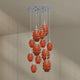 s.luce Echos Galerieleuchte 12-flammig Ø 80cm Baldachin Ø 18/25cm mit orangefarbenen Glaskörpern.