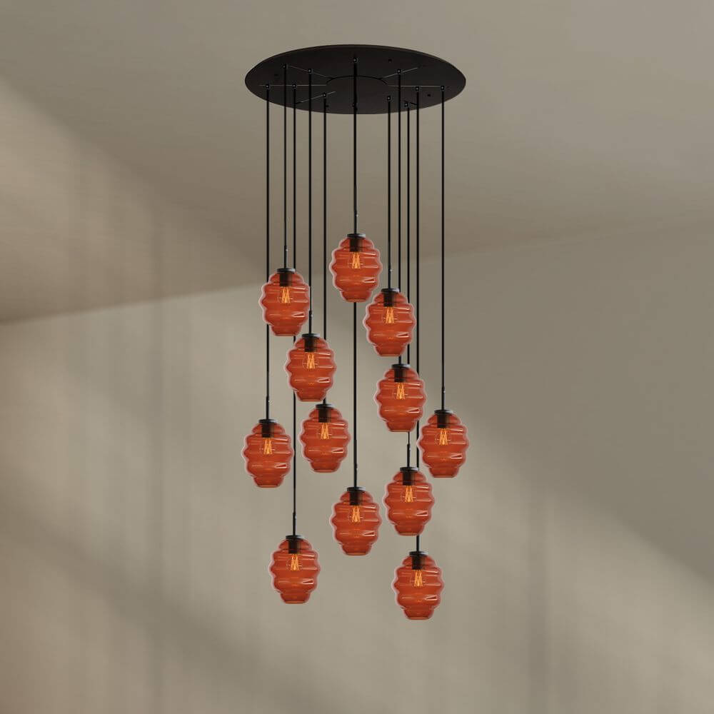 s.luce Echos Galerieleuchte mit 12 mundgeblasenen Glaskörpern in Orange, elegantes Design für modernen Wohnraum.