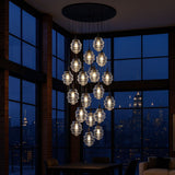 s.luce Echos Galerieleuchte 20-flammig mit mundgeblasenen Glaskanistern in modernem Raumdesign.