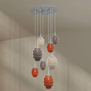s.luce Echos luminaire de galerie à 8 lumières Ø 80 cm rosace Ø 18/25 cm avec des corps en verre colorés.