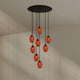s.luce Echos Galerieleuchte 8-flammig Ø 80cm Baldachin Ø 18cm mit orangefarbenen Glaskörpern