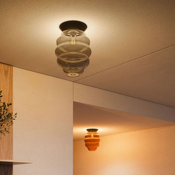 s.luce Echos glass ceiling light in a modern room, harmonious design with an oval glass shape.