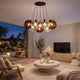 s.luce Orb Cluster Mehrfach-Pendelleuchte 7-flammig 7x20cm im modernen Wohnzimmer, elegantes Design mit Glaskugeln und warmem Licht