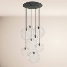 s.luce Orb Galerielamp 8-vlammig Modular, elegante pendellamp met transparante glazen bollen.