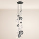 s.luce Orb 12-flammige Modular Pendelleuchte mit eleganten Glasröhren in verschiedenen Größen und Farben.