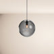 s.luce Orb glass ball pendant light in modern design, floating from the ceiling with stylish light.