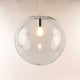 s.luce Orb glass ball pendant light in artistic design with transparent glass and bright light.