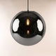 s.luce Orb glass ball pendant light in stylish black glass with a bright light inside.