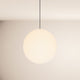 s.luce Orb glass ball pendant light in minimalist round shape against a bright background.