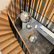 s.luce Orb glass ball pendant light in the staircase with elegant wooden stairs and modern design.