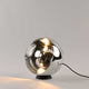 s.luce Orb Glaskugel Tischlampe in minimalistischem Design mit schwarzem Metallring, elegant und modern.