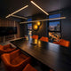 s.luce Oris LED linear lamp office pendant light XL custom-made 2700K in a stylish conference room at night.