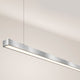 s.luce Oris LED linear light office pendant lamp XL made to measure 4000K in modern design above a workspace.
