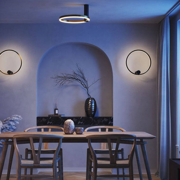 s.luce Ring Air LED Wand- & plafondlamp Ø 40 cm rond indirect in een moderne woonruimte met elegant meubilair.
