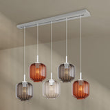 s.luce Velo Esstischlampe 5-flammig 160cm Baldachin Ø 20cm mit eleganten Glasleuchten über dem Esstisch.