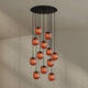 s.luce Velo 12-flammige Galerieleuchte Ø 80cm Baldachin Ø 20cm mit orangen Pendelleuchten