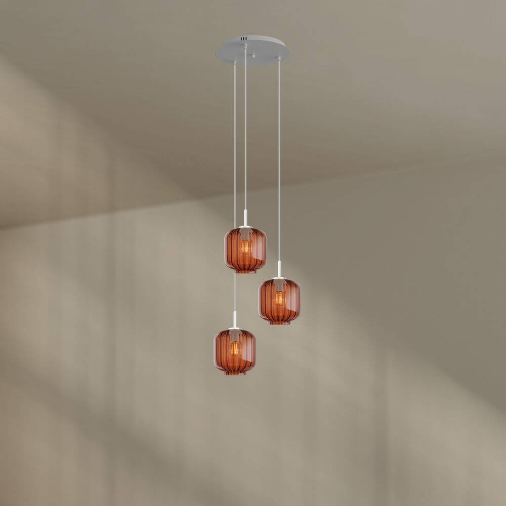 s.luce Velo 3-flammige Galerieleuchte mit drei mundgeblasenen Glaspendelleuchten in Orange.