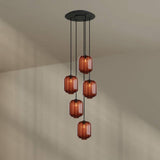 s.luce Velo 5-flammige Galerie-Hängelampe mit hochwertigem Baldachin und edlen Glaspendeln in eleganten Orange-Tönen.