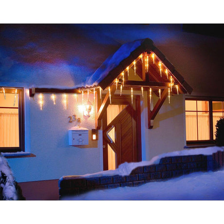LED Icicle light curtain 32 icicles 48 cool white diodes IP44 on the winter house with snow.