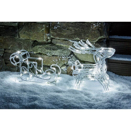 LED Acryl-Set Schlitten mit 2 Rentieren 96 Kaltweiße Dioden 24V in winterlicher Schneelandschaft