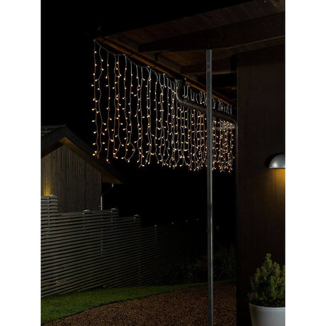 LED Light curtain with white globes 400 warm white diodes IP44, luminous winter decoration for outdoor use.