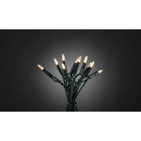 LED Minilight chain One String 200 warm white diodes with warm light on a black background.