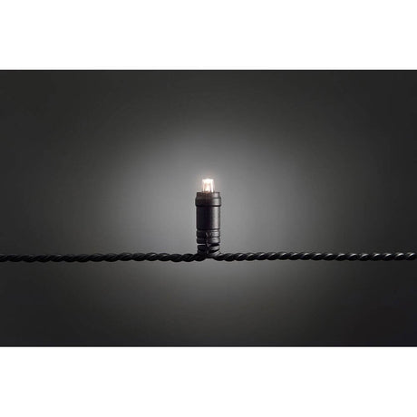 31m Micro LED string lights with 9h timer IP67 120 warm white diodes IP44 on black background